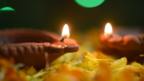 Clay diya lamps lit during Diwali festival Celebration. Indian Hindu Light Festival called Diwali