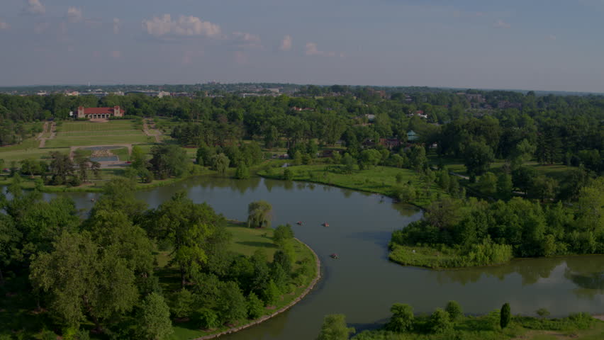 Drone about Forest Park pans over Lake and Paddle Boats and Museum