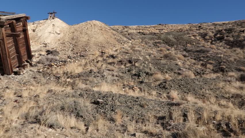 Mining ruins in Nevada Ghost town.  Ore bin sits crumbling on the hill side.