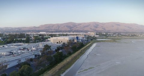 SAN FRANCISCO, CALIFORNIA, USA. 17 JUNE 2018. Aerial Shot Of Tesla Factory Headquarters and surrounding businesses In Fremont, Silicon Valley