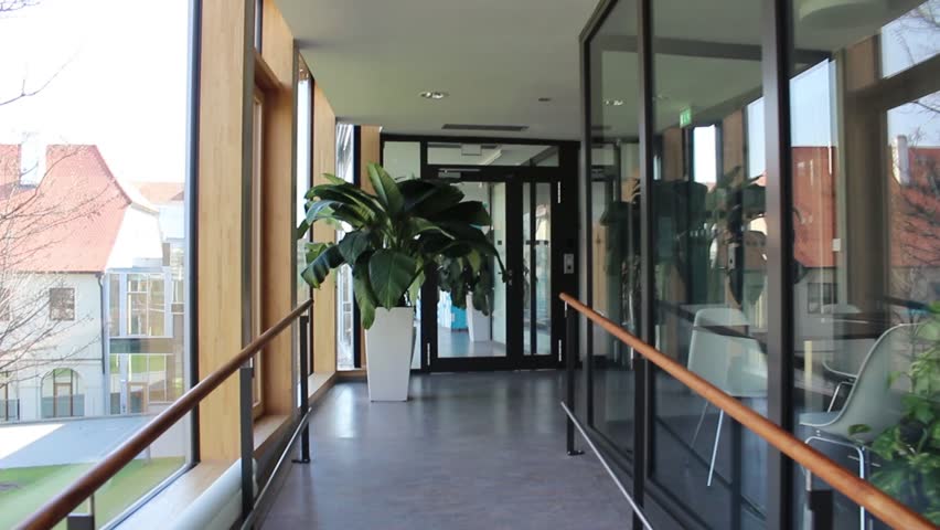 Passage through a corridor backwards in a technological building.