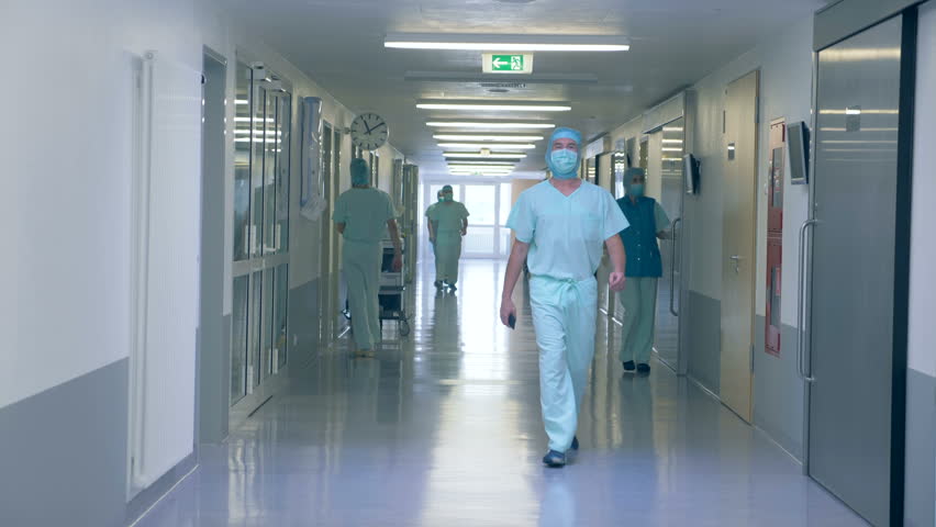 View of a hospital hall. Many people in a clinic hall, working.
