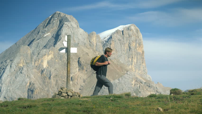 Hiker trekking in beautiful alpine environment