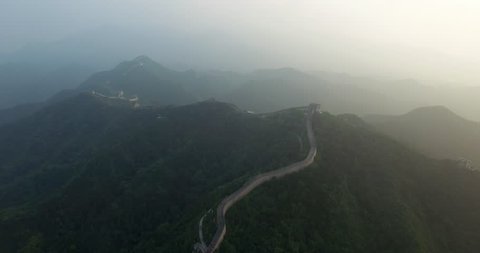 Flying over the China great wall at sunset. Aerial view of China great wall at sunset.
Amazing aerial view of China great wall.
