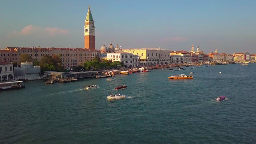 Aerial view of Venice, St Mark's square. Scenic video taken at sunrise. San Marco square in Venice, Italy it's the principal public square of Venice, where it is generally known just as the Piazza. Royalty-Free Stock Footage #1017765556