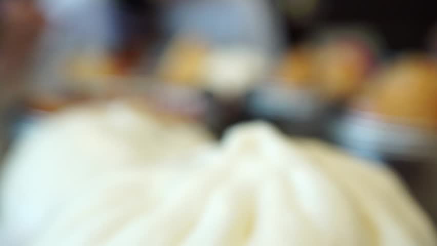 blur girl enjoys eating variety dim sum foods with chopsticks at Chinese restaurants