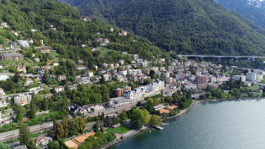 Aerial panoramic view of city of Montreux, resort town by Geneva Lake (Lac Leman), late summer - landscape panorama of Switzerland from above, Europe