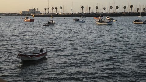 Early morning view of fishing boats on the marina and pier in Cascais, Portugal. Cascais is a popular summer vacation spot for Portuguese and foreign tourists