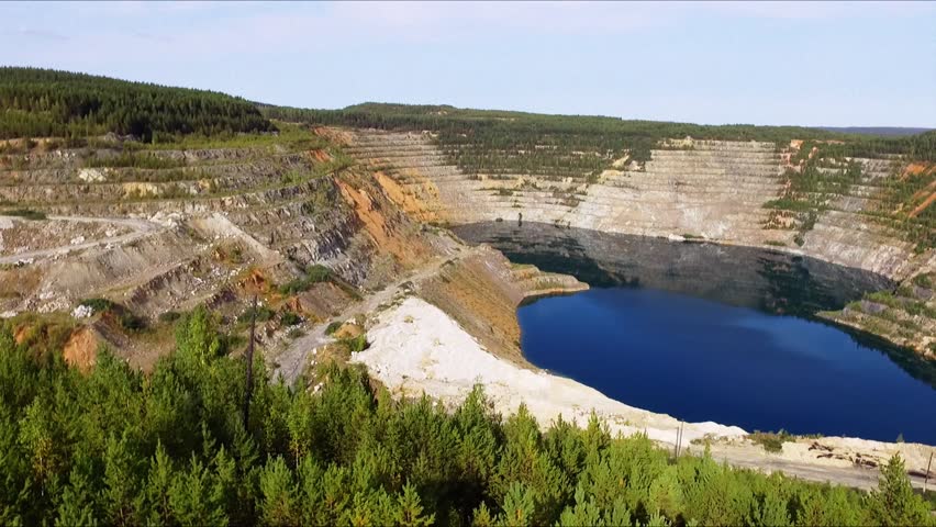 aerial view with drone,  industrial landscape,the flooded pit. Summer, sunny day.