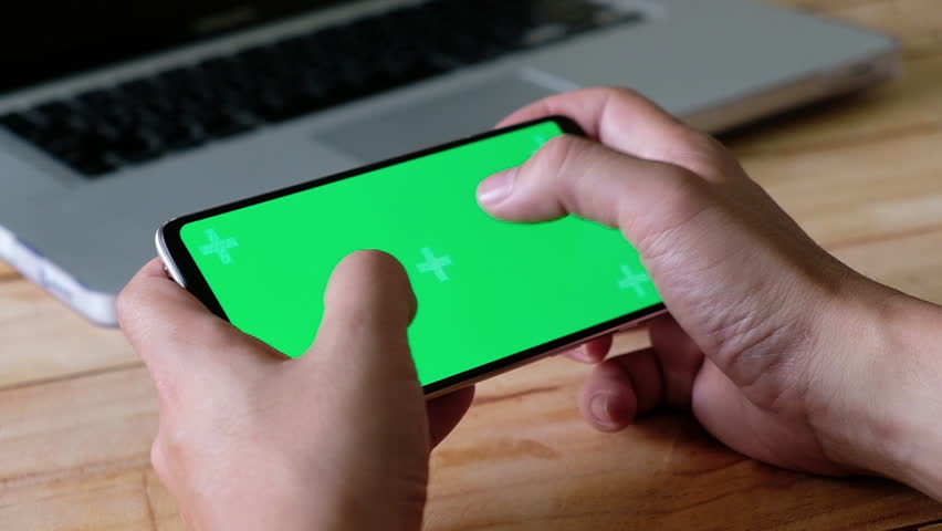 Hands using a Smart phone Touchscreen CHROMA KEY Man playing game on smartphone