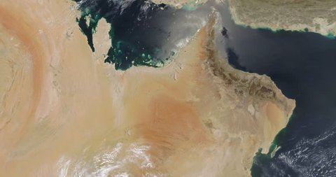 Very high-altitude overflight aerial of Persian Gulf, Gulf of Oman and surrounding land . Clip loops and is reversible. Elements of this image furnished by NASA