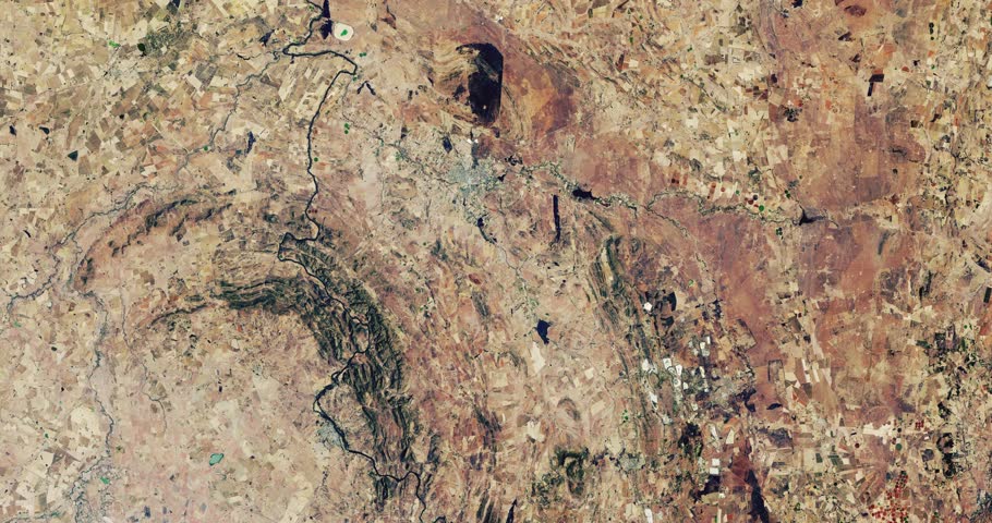 Very high-altitude overflight aerial of drought-stricken farmland southwest of Johannesburg, South Africa. Clip loops and is reversible. Elements of this image furnished by NASA