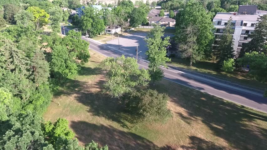 Flying Over Road By Apartments