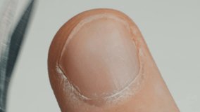 macro male nail grooming on hand's finger