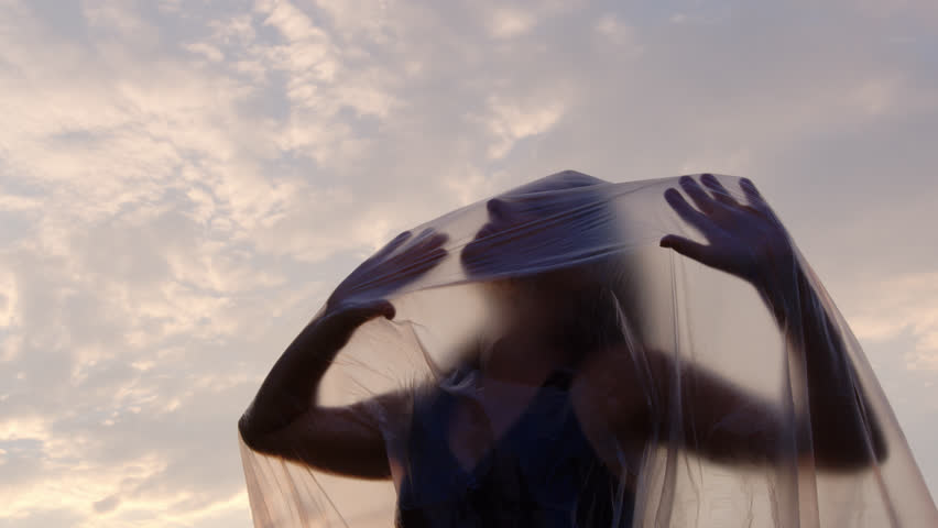 Slow Motion Shot Of A Woman Trying To Break Free From Her Plastic Foil Prison