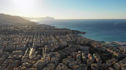 Aerial panoramic view of cityscape of Genoa (Genova), famous port and capital city of Liguria at sunrise - landscape panorama of Italy from above, Europe