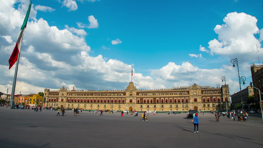 Hyperlapse of National Palace of Mexico in shiny day, the flag flutters. Is one of the most important historic buildings in Mexico and an attractive tourist.