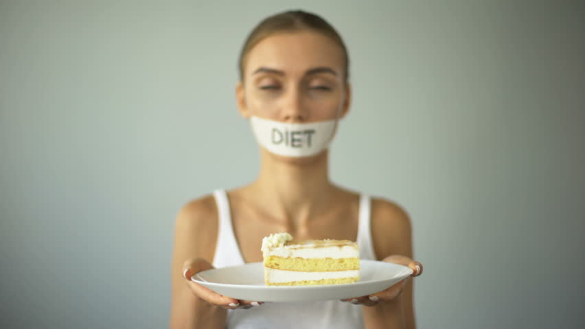 Skinny girl refuses to eat cake, low-carb diet, obey advice of nutritionist Royalty-Free Stock Footage #1017823324