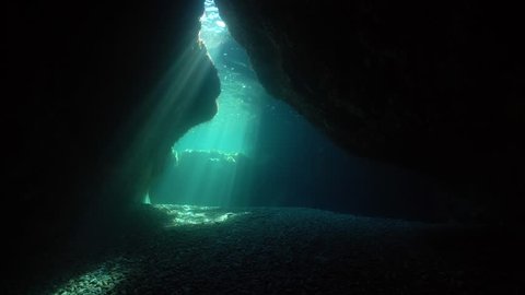 Natural sunlight at the exit of a shallow cave underwater in the Mediterranean sea, Pyrenees-Orientales, Roussillon, France