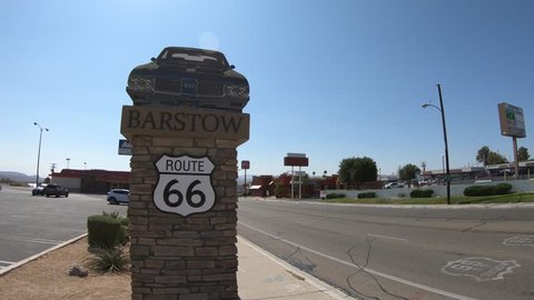 Barstow, California, USA - August 15, 2018: Barstow Sign with 1960s Oldsmobile 442 along Route 66.Barstow is located in Mojave Desert between Los Angeles and Las Vegas.