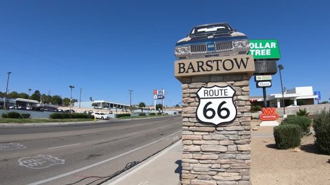 Barstow, California, USA - August 15, 2018: Barstow Sign with 1960s Oldsmobile 442 on main street Route 66. Barstow is in Mojave Desert between Los Angeles and Las Vegas.