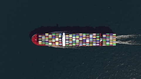 Cargo ship in the ocean, top view