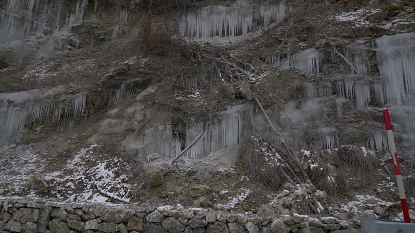 Icicles on a hill along the road