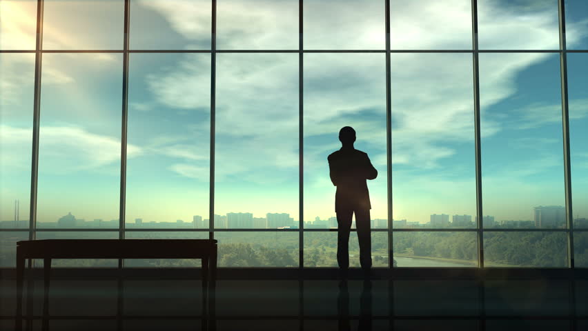 Silhouette of a trader in the office before infographics | Shutterstock HD Video #1017857938