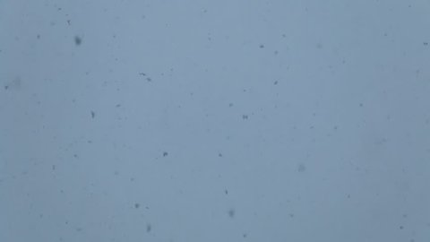 Falling snow, and close-ups of snow and snowflakes, bottom view