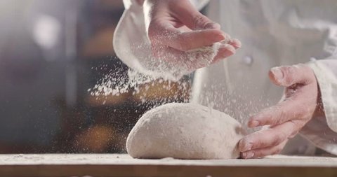 An experienced chef in a professional kitchen prepares the dough with flour to make the bio Italian pasta. the concept of nature, Italy, food, diet and bio.