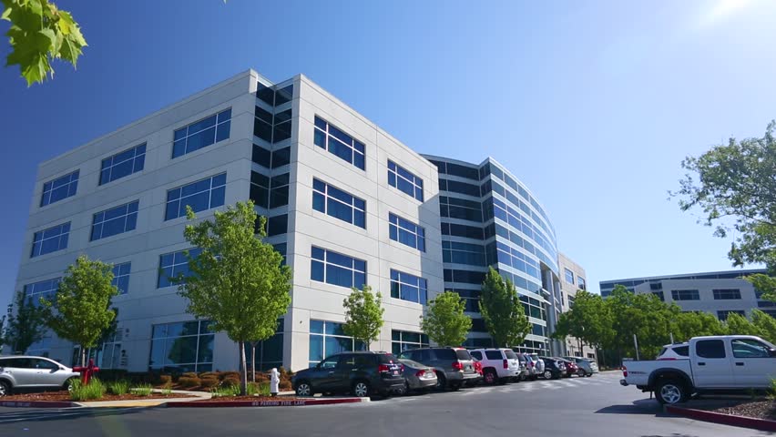 Exterior of a modern office building on sunny day - Powered by Shutterstock - Get 15% off with code: PIKWIZARD15