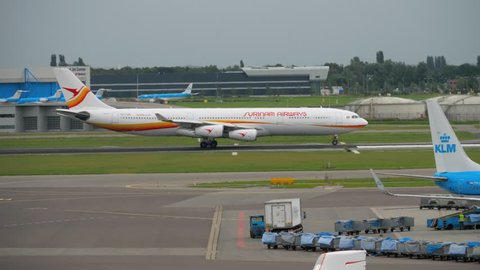 AMSTERDAM, THE NETHERLANDS - JULY 29, 2017: Airbus A340 Surinam Airways PZ-TCR accelerate before departure. Shiphol Airport, Amsterdam, Holland