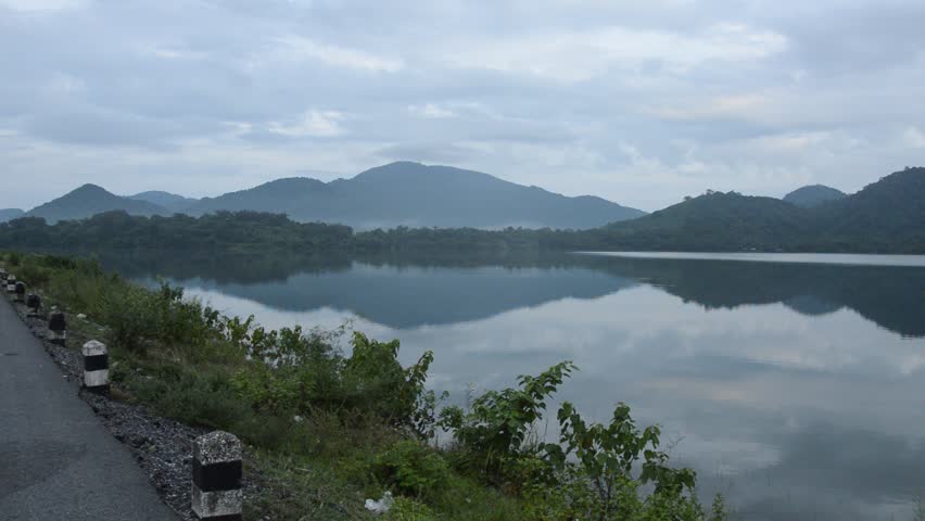 landscape of water reservoir lake with mountain background