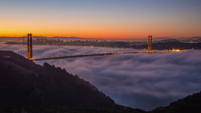 Time lapse clip of a fog at sunrise over the Golden Gate Bridge and San Francisco