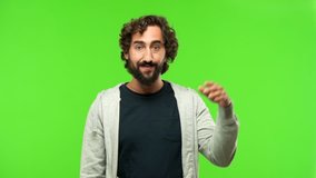 young crazy man realizing gesture against green chroma key background