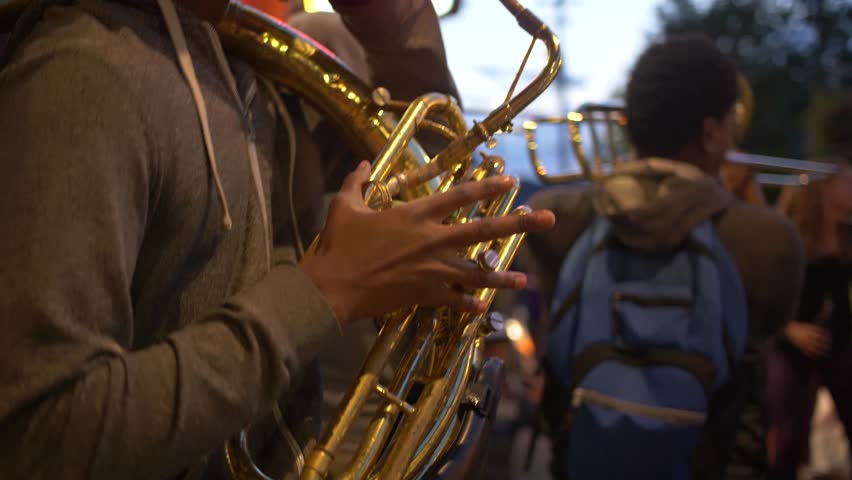 New Orleans, Louisiana / USA - May 14th 2018: Street Musician Playing Tuba, Tourists Dancing