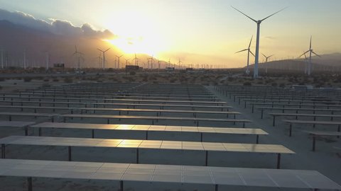 Solar Panels at Sunset and Wind Farm Alternative Energy Choices