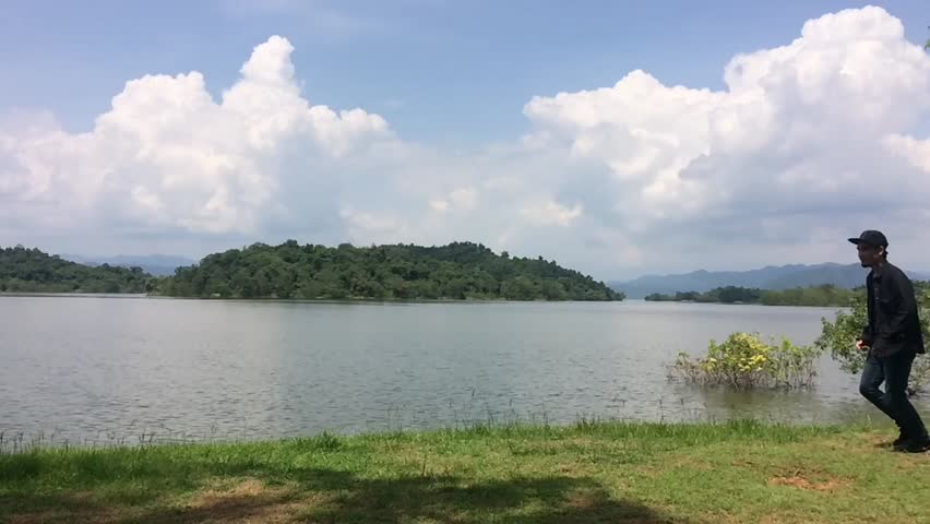 Couple happy in holiday travel at dam and fun jumping slow motion clip VDO