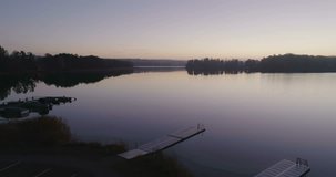 Beautiful nature and landscape video of sunrise at Djolo in Katrineholm, Sweden. Nice misty autumn morning at the lake, Filmed with drone from sky, 
