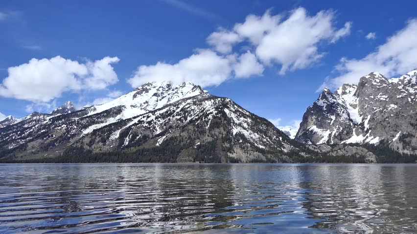 Spectacular Jenny Lake scenery with beautiful snowy mountain peaks across water