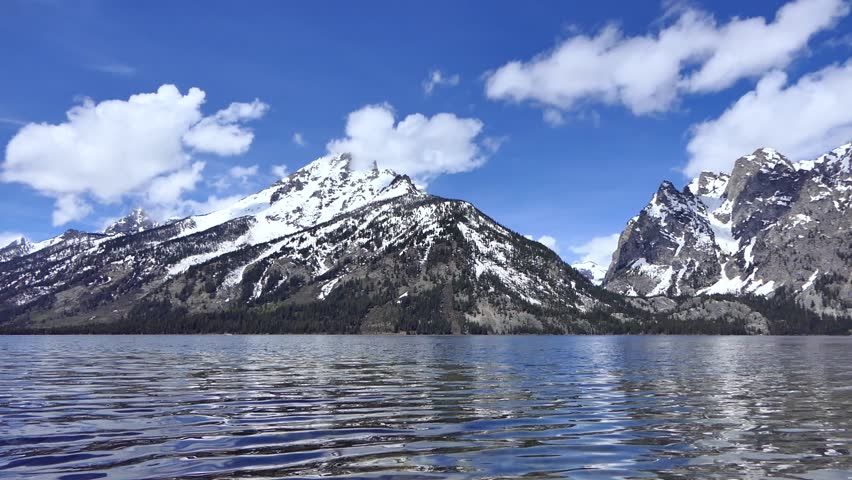 Spectacular Jenny Lake scenery with beautiful snowy mountain peaks across water