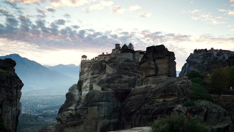 Scenic sunset dark evening sky over holy Varlaam monastery on cliff in Meteora, Thessaly Greece. Greek destinations. Time lapse 库存视频