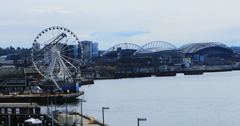 SEATTLE, WASHINGTON/UNITED STATES- OCTOBER 3, 2018: Great Wheel and sport stadiums in Seattle, Washington 4K