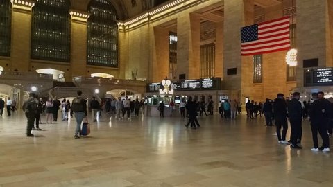 New York, New York, USA - October 14, 2018: A hyperlapse timelapse of the main concourse of Grand Central Terminal around the information booth. Many people.