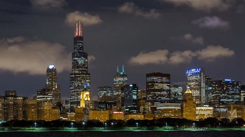 Chicago, Illinois, USA - September 18th 2018 - Chicago Skyline Buildings and Clouds at Night Timelapse