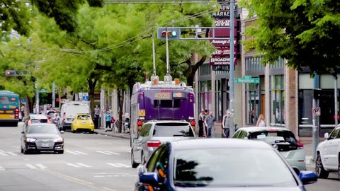 Seattle, Washington / United States - 07 07 2018: Electric bus pulling over on Broadway in Seattle