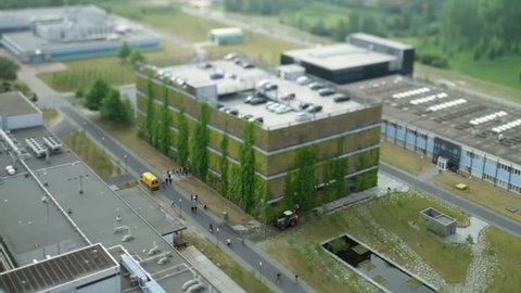 Overview of The High Tech Campus in Eindhoven toward parking garage. Brainport. Noord-Brabant. Tilt-shift / timelapse