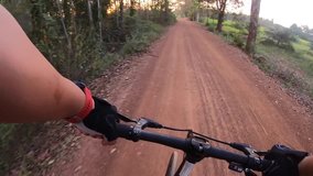 Video footage  front view. Ride a bike on a country road . Mountain biking .