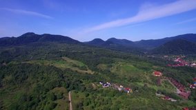 Aerial Drone Footage View 4k. The mountain hills are located in the village