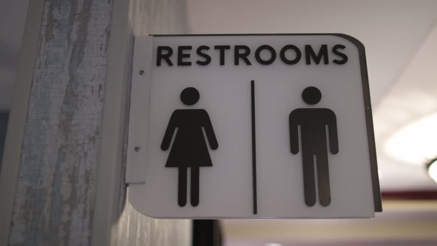 Restrooms sign white hanging icons close Royalty-Free Stock Footage #1018025839